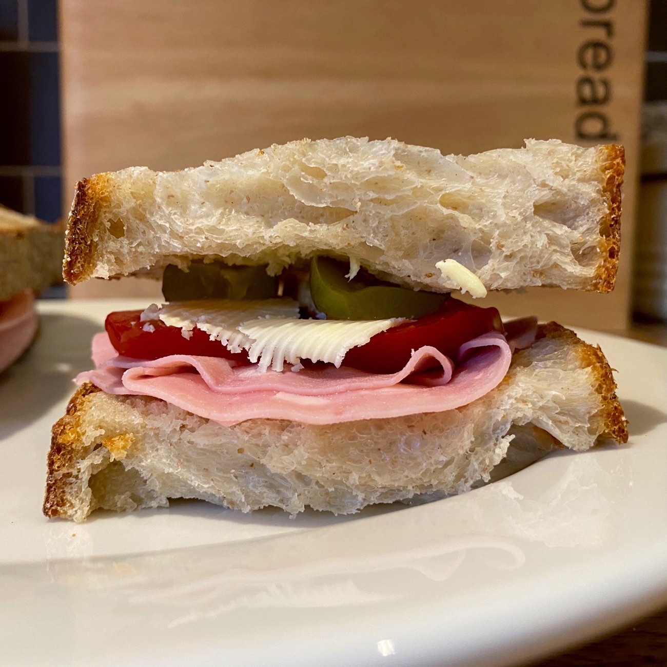 Pickles, Cheese, Tomato, and Ham Sandwich